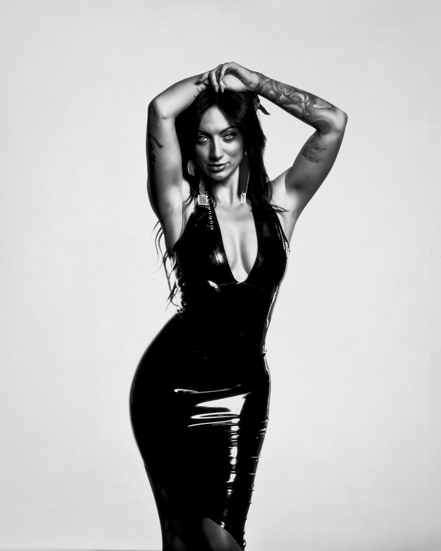 Amelia Latex asymmetrical hem halter dress in Black.