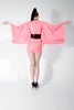 Latex kimono mini dress, in Vibrant Pink with black skull applique. Black Detachable belt included.